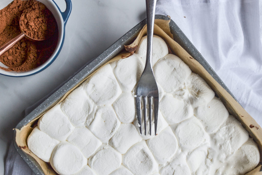 marshmallows melted on top of brownie base