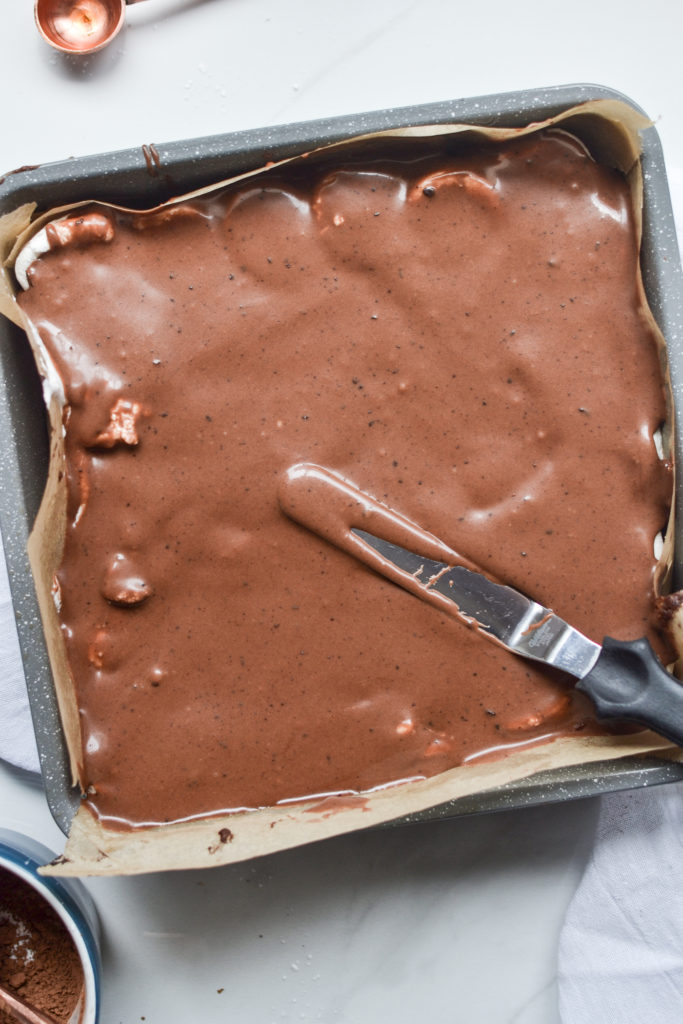 fudge frosting on top of brownies with marshmallows