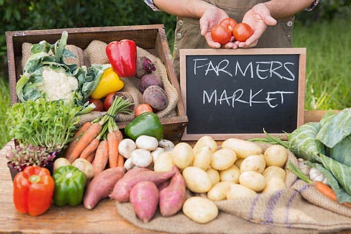 Vegetables and Fruit with a chalkboard Farmers Market sign