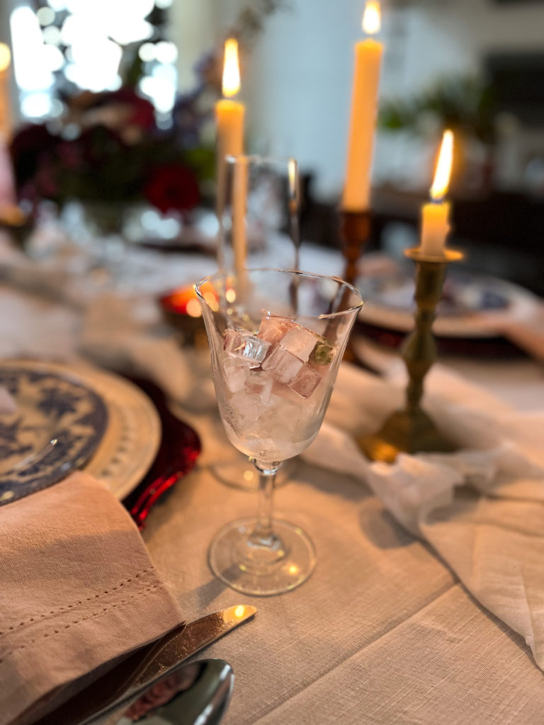 Flickering candles on a Valentines Day Tablescape.