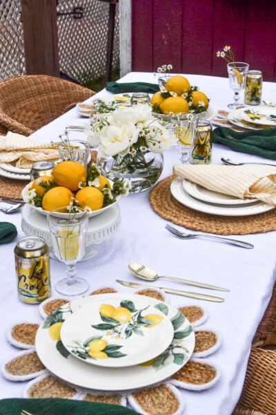 An outdoor table decorated in a lemon theme
