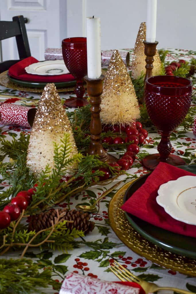 Faux cedar garland and red wood beads make a cottage style table centrepiece for Christmas