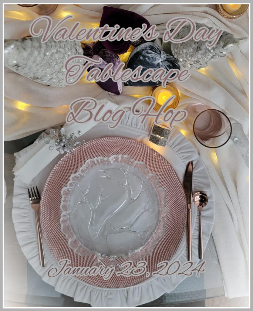Valentines Day tablescape image of a pink plate on a white tablecloth.