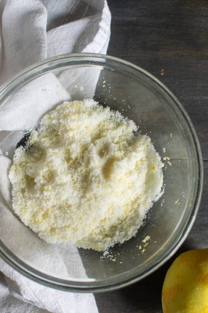 Rub lemon zest into sugar to release oils