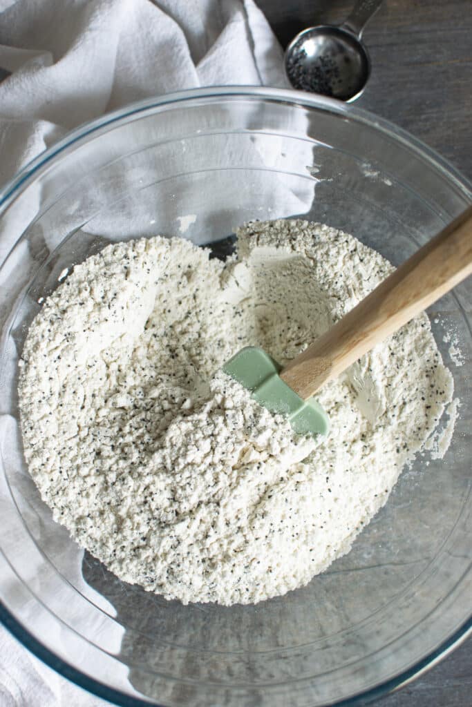 Dry ingredients for muffins in a glass bowl.