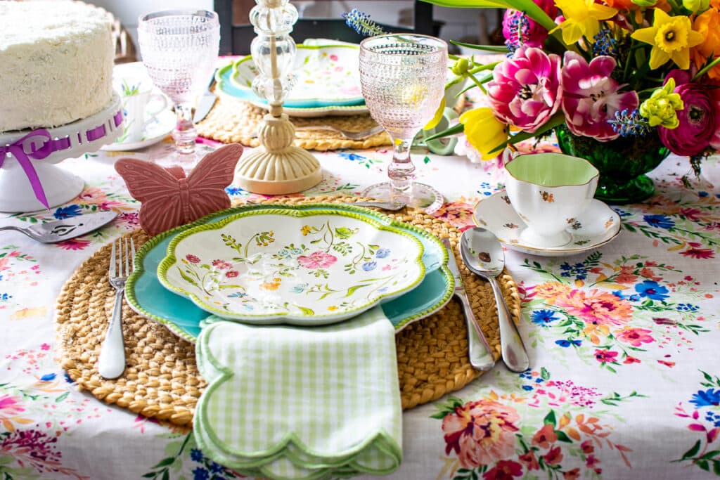 A place setting for spring.  Floral plate, green gingham napkin with scalloped edges.