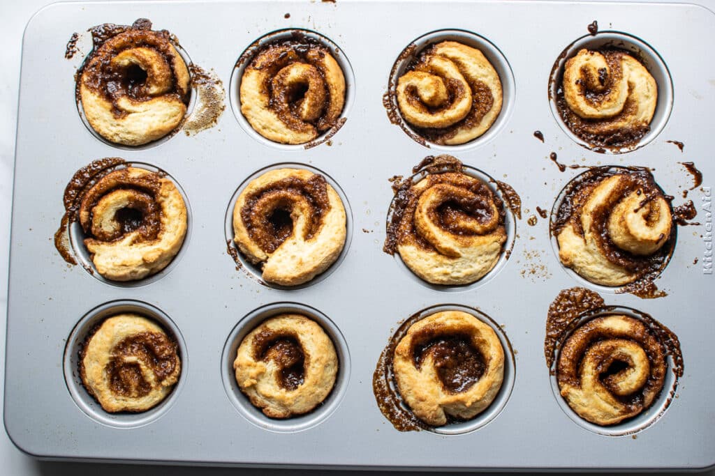 freshly baked cinnamon rolls made in muffin tins.
