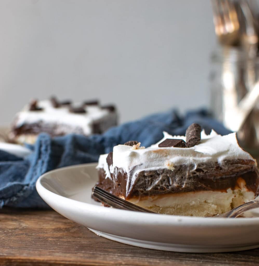 Chocolate Lush Dessert made with cream cheese, whipped cream and chocolate pudding.