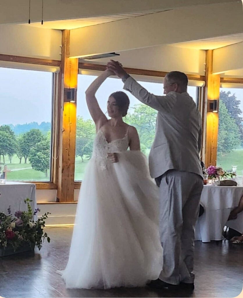 Father and daughter dancing at her wedding.