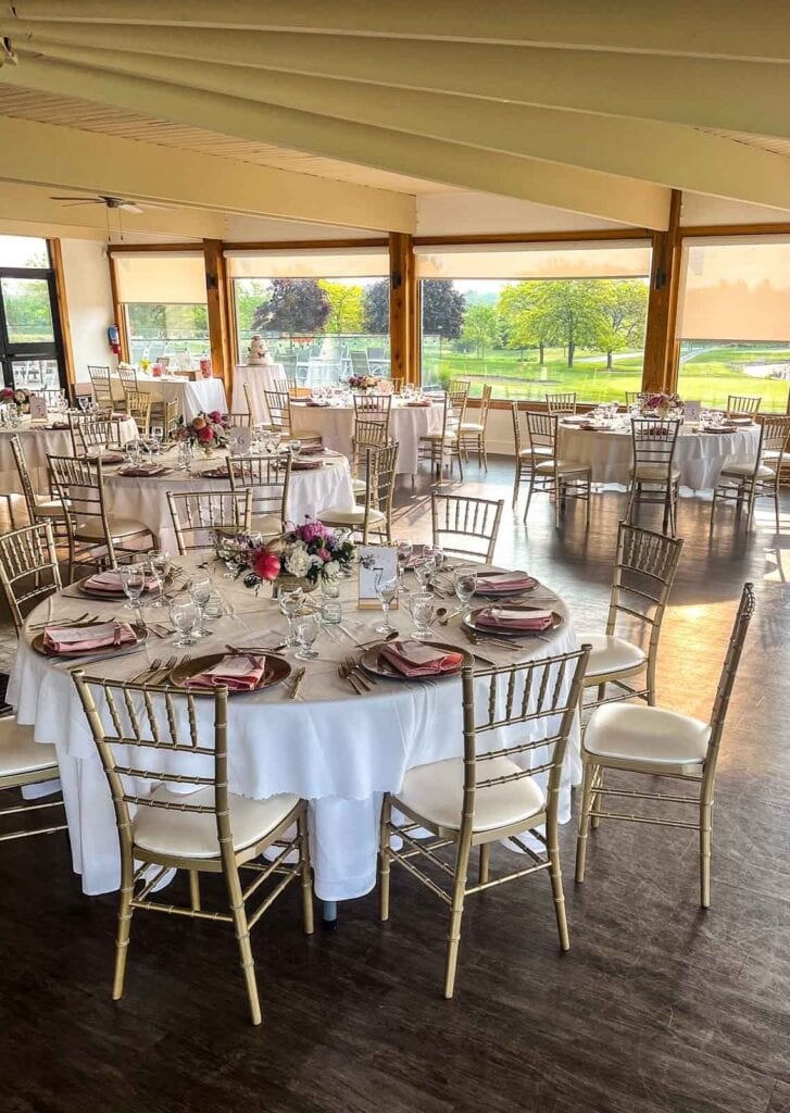 A wedding venue with the tables set for a June wedding.