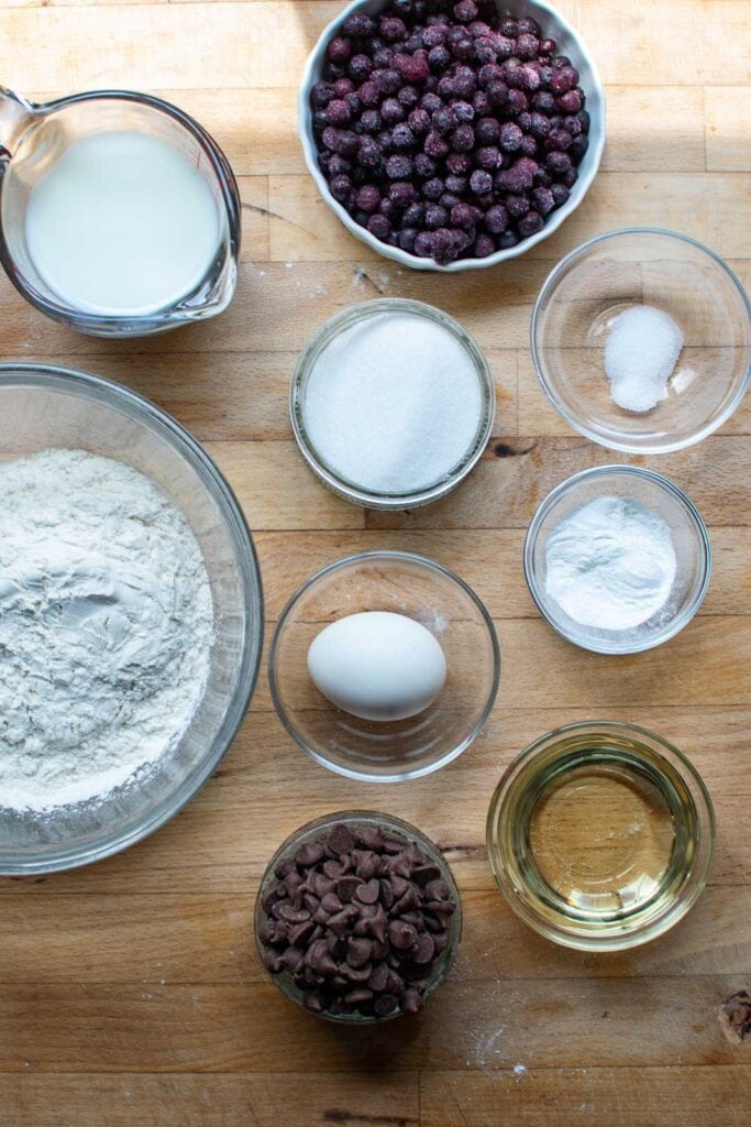 All the ingredients needed to make blueberry chocolate chip muffins.