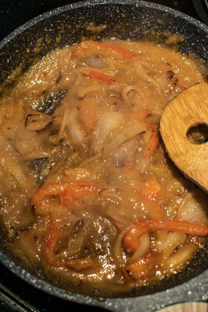 Soya and cornstarch mixture added to fried onions and peppers to make a thickened sauce.