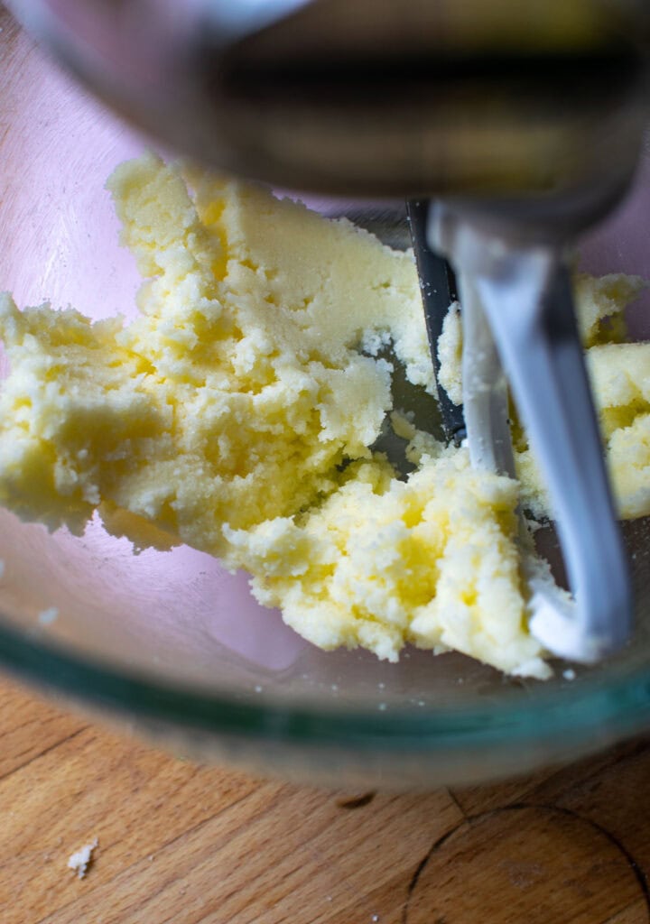 Sugar and butter creamed until fluffy in bowl of electric mixer.
