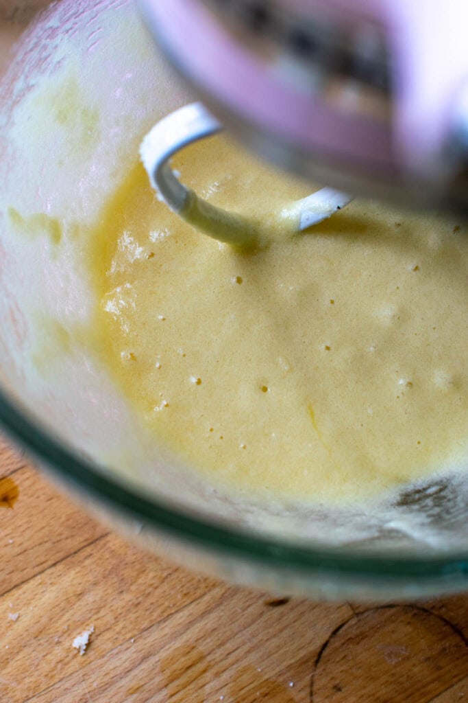 Vanilla and eggs mixed into the butter and sugar mixture to make cake batter.