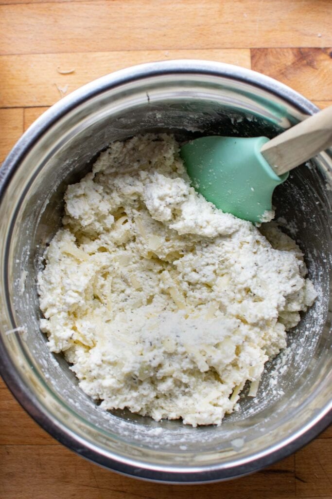 Mozzarella, parmesan and ricotta cheeses mixed together to make manicotti.