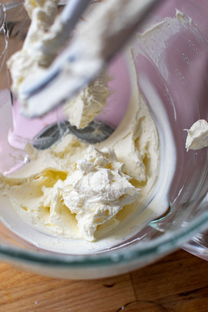 Cream cheese whipped with confectioners sugar for a pumpkin mousse recipe.