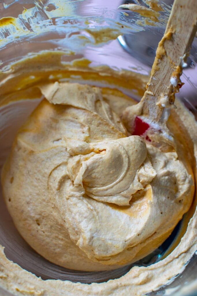Fresh whipped cream folded into pumpkin cream cheese mixture to make pumpkin mousse.