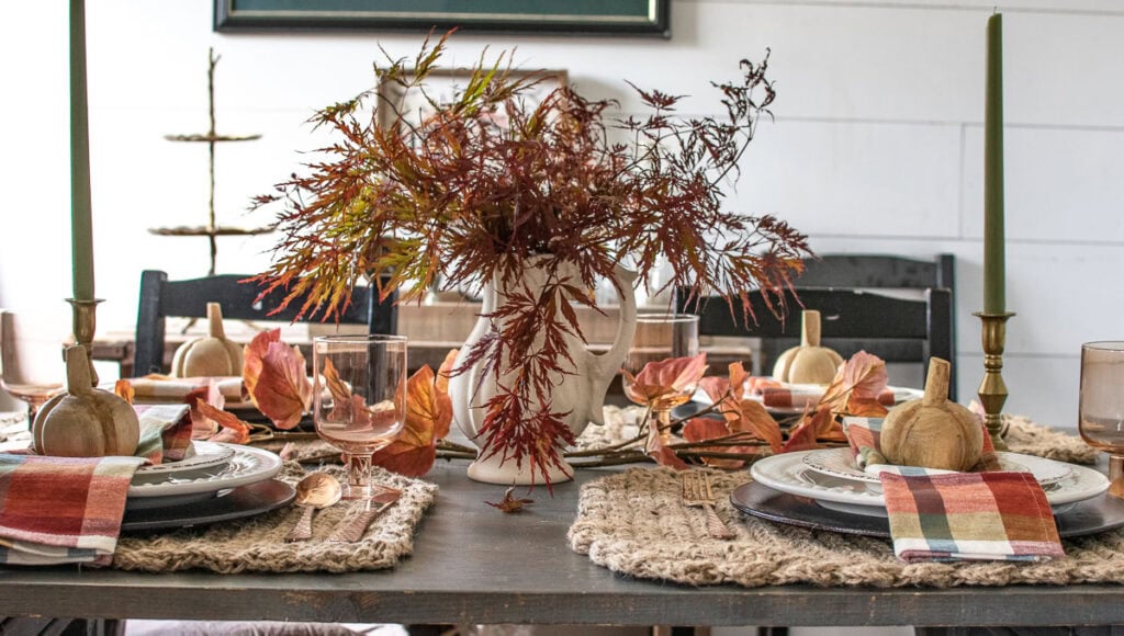 A cozy autumn dinner table with shades of amber, orange and blue.