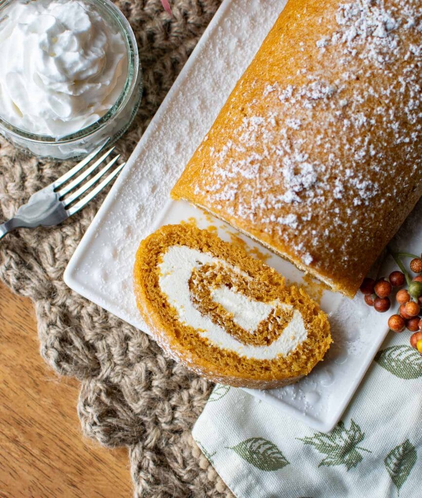 A pumpkin roll cake with cream cheese filling.