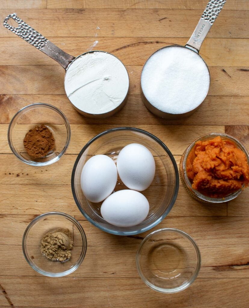 Ingredients to make a pumpkin spice sponge cake.