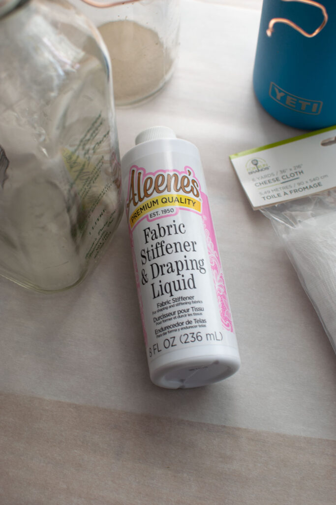 A bottle of Fabri stiffer and draping liquid.