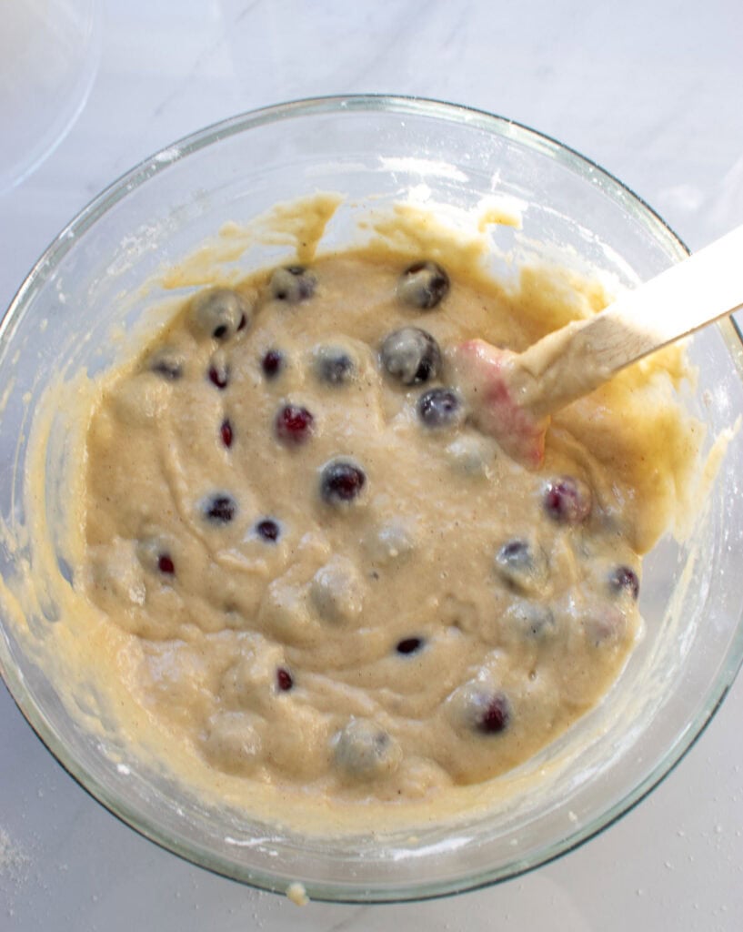 Fresh cranberries stirred in the batter for cranberry applesauce loaf.