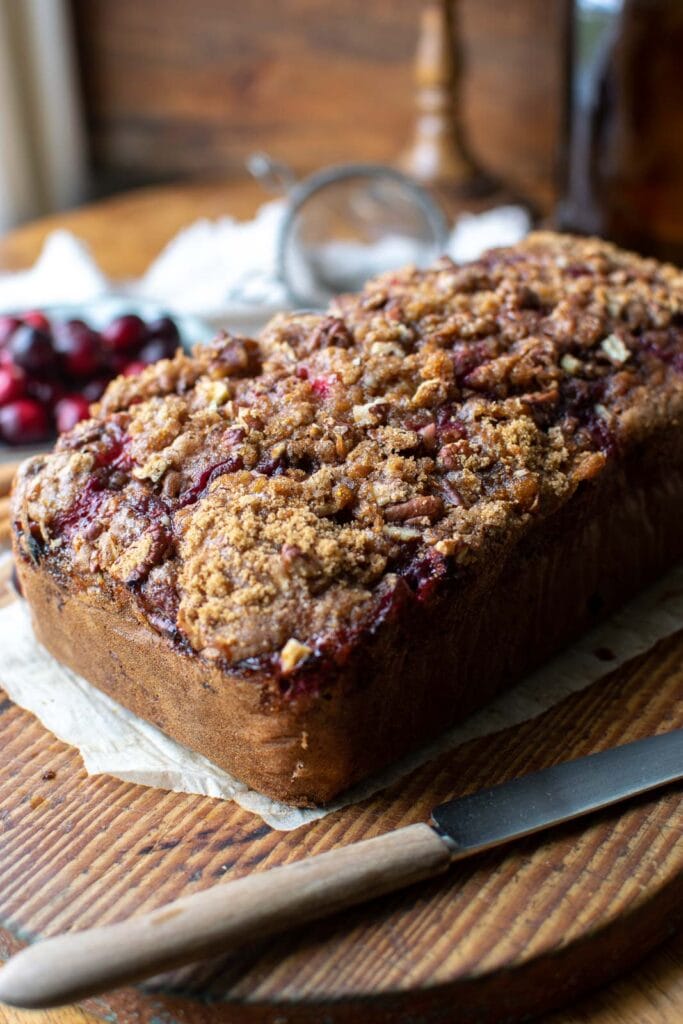 A loaf of cranberry applesauce bread fresh from the oven.