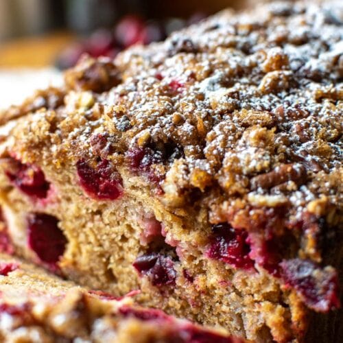 Close up of a cranberry loaf sliced to see the inside.