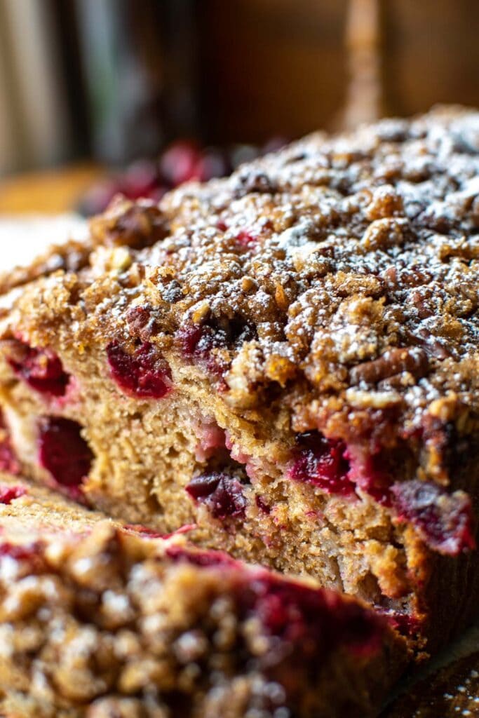 Close up of a cranberry loaf sliced to see the inside.