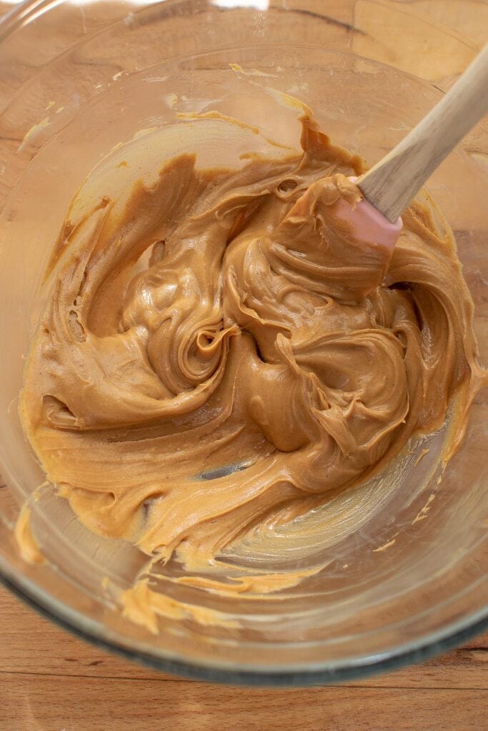 whipped peanut butter in a glass mixing bowl.