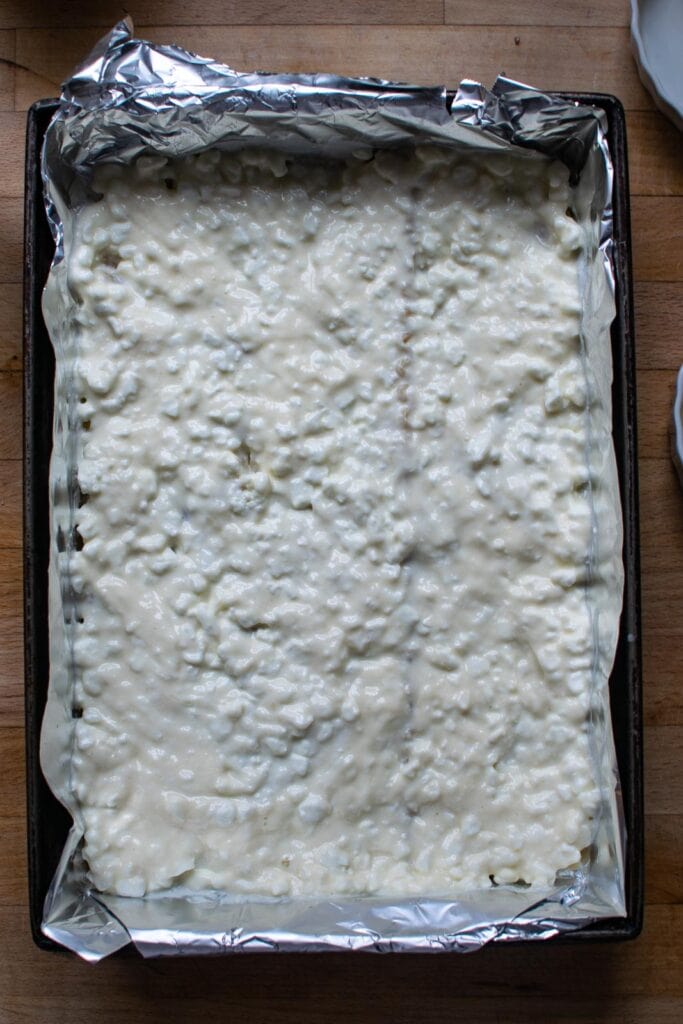 Cottage cheese mixture spread over a layer of cooked lasagna noodles.