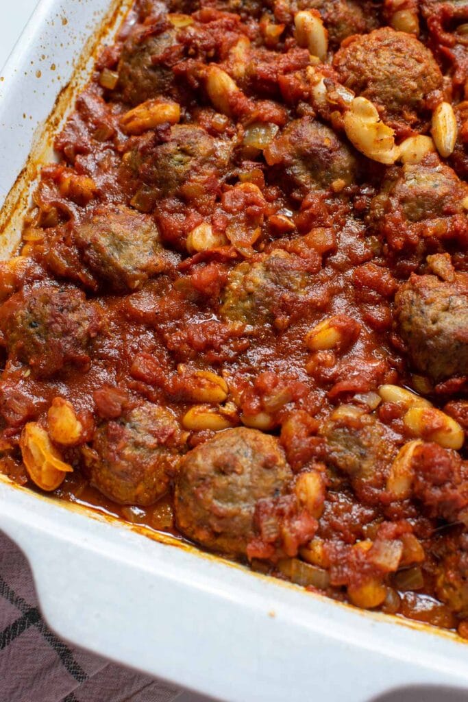 Freshly baked meatball chili casserole in a ceramic casserole dish.