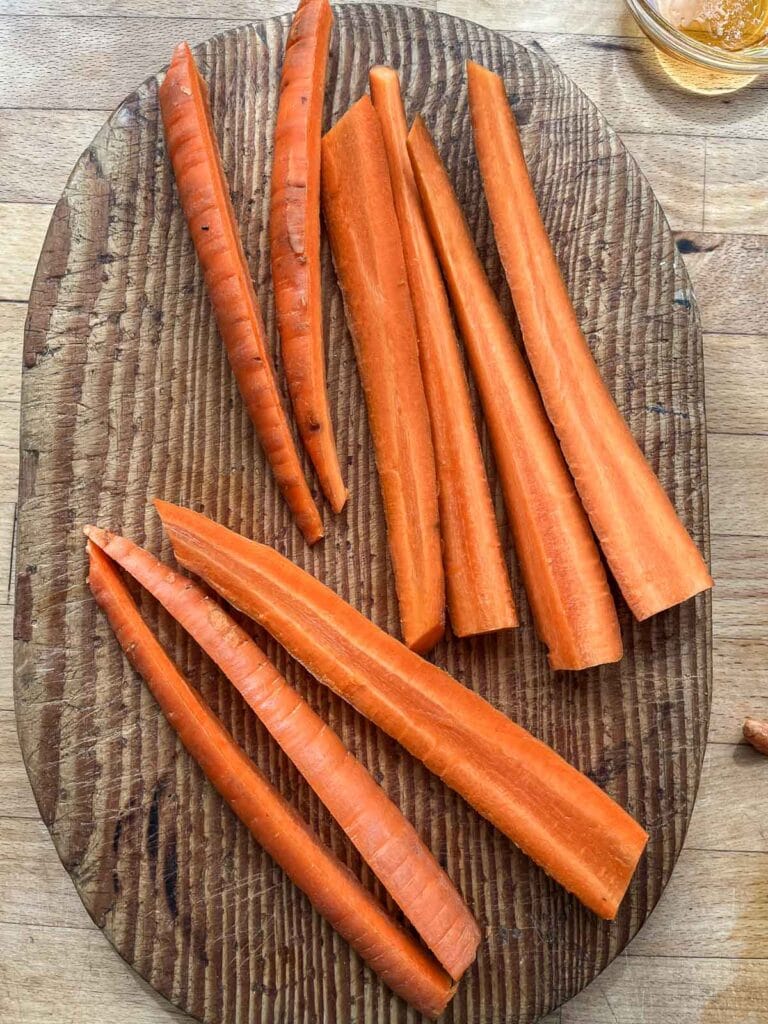 Carrots sliced vertically into halves and thirds.