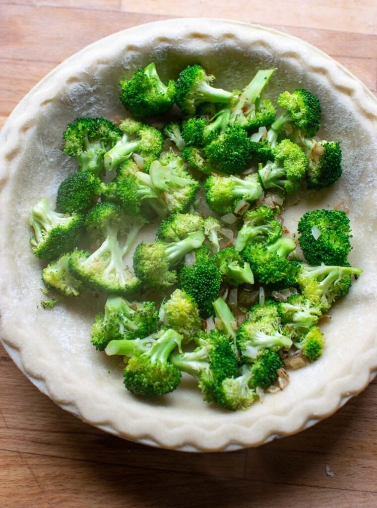 Sautéed broccoli and onions in a pie shell.