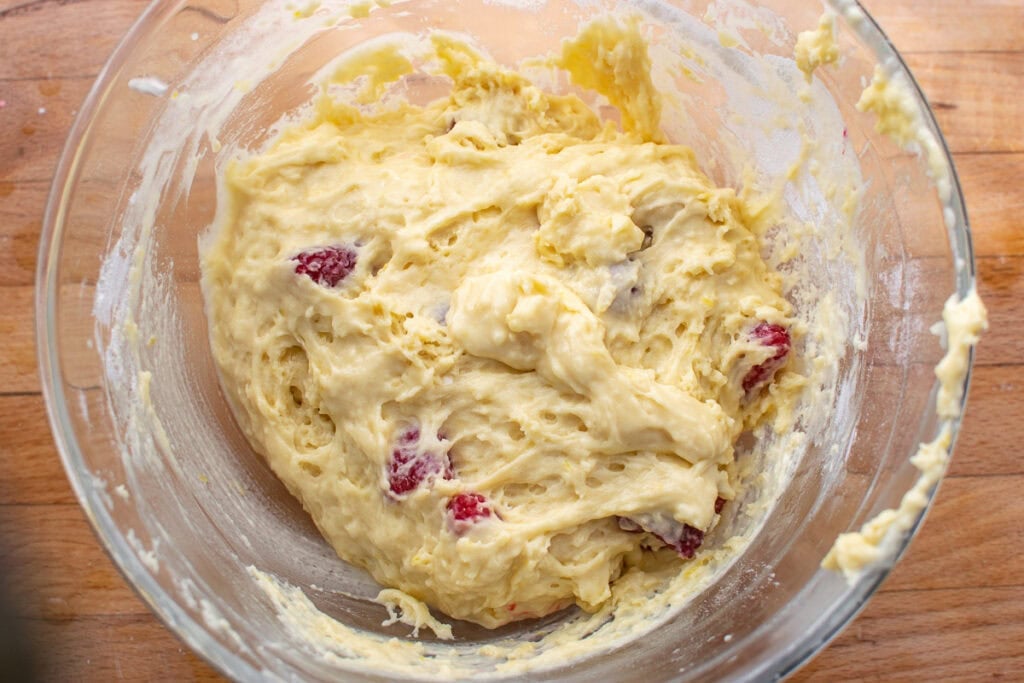 Raspberries stirred into lemon muffin batter.