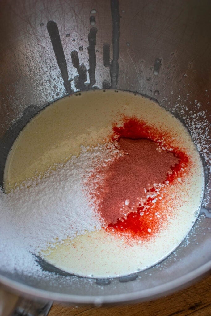 whipping cream, icing sugar and strawberry Jello powder in the bowl of an electric mixer before whipping.