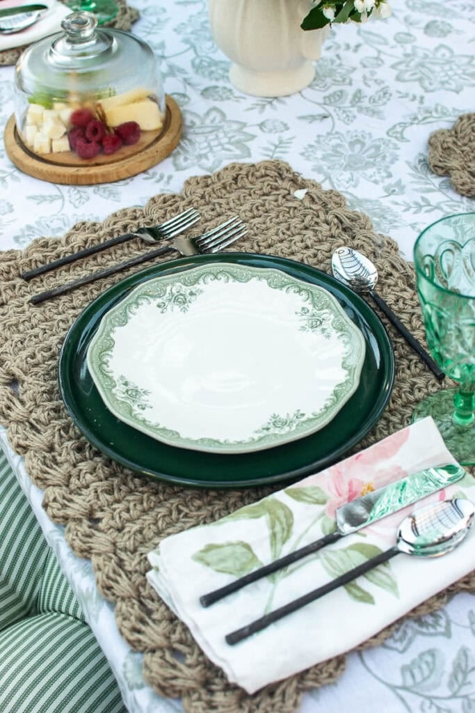 A place setting on an outdoor table for a summer gathering with friends.