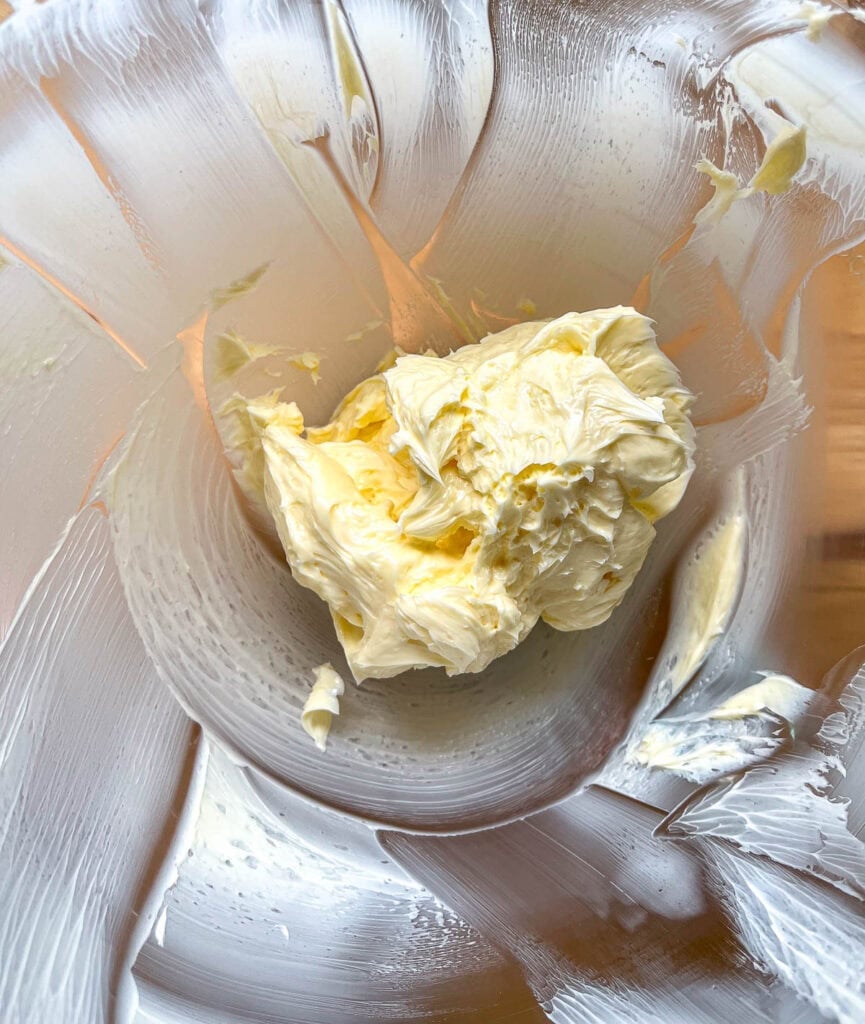 Butter that has been creamed in bowl of electric stand mixer.